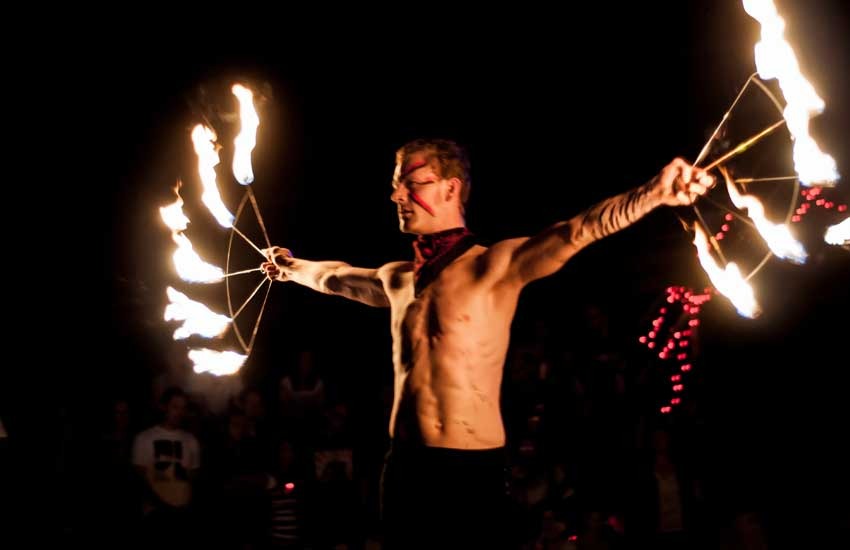 Fire juggler on rent performing a live flame show at an evening event in Noida