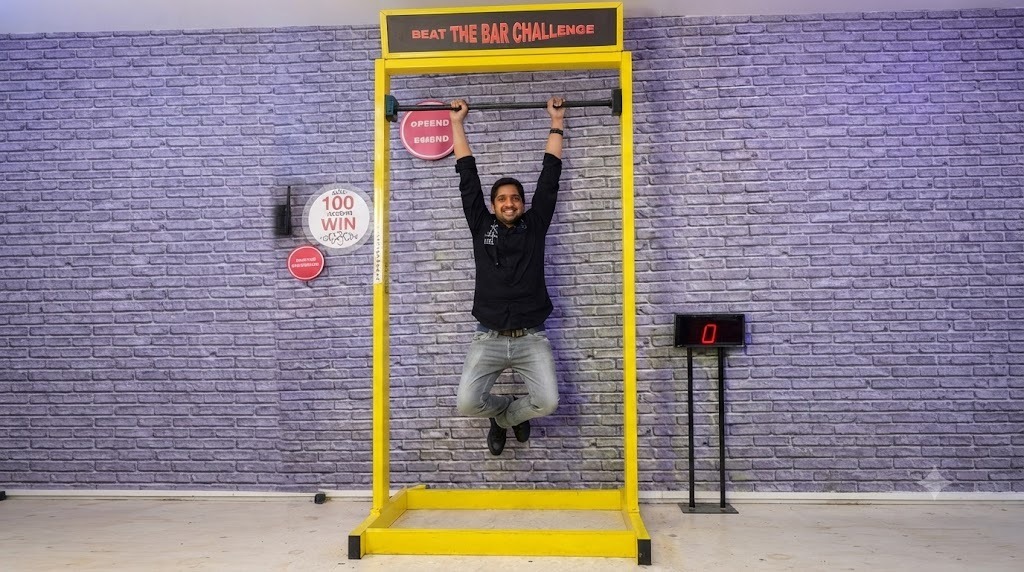 Hanging Bar Challenge Game On Rent setup at a corporate event in Delhi